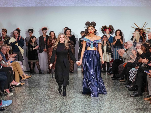 HCC Fashion Design student Tanya Roche walks with her model wearing her winning design “Hummingbird” in the Reengineer: Repurpose the Forgotten category.