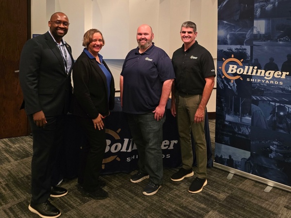 Representatives from HCC and Bollinger Shipyards pose for a photo.