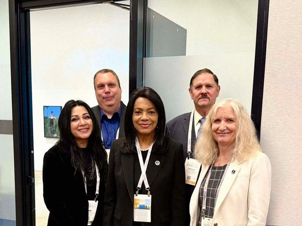 Back row (from left to right): Bob McCracken, Vice Chancellor of Administration and Operations; Terrance Corrigan, Executive Director of Internal Auditing. Front row (from left to right): Dr. Rima Adil, Vice Chancellor of Strategic Communications & Marketing; Dr. Margaret Ford Fisher, Chancellor; Andrea Burridge, Vice Chancellor of Strategy, Planning & Institutional Effectiveness.