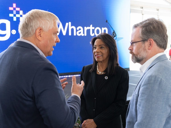 Matthew Pistner, president of NRG Wholesale, visits with Chancellor Margaret Ford Fisher, Ed.D., and HCC Trustee Sean Cheben following the partnership announcement