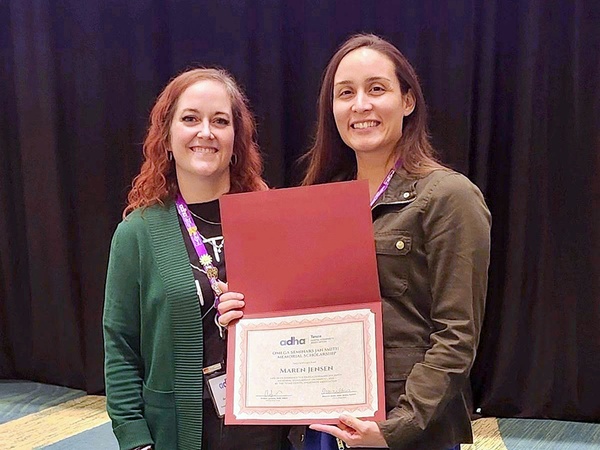 Dental Hygiene student Maren Jensen of Katy, Texas, accepts the Omega Seminars Jan Smith Memorial Scholarship at the Texas Dental Hygiene Association conference on March 1.