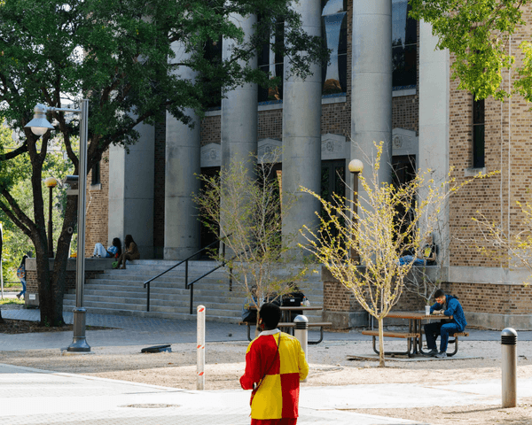 Students walk past the Heinen Theatre at the HCC Central Campus.