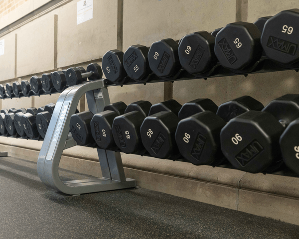 A rack full of free weights sits in the Wellness Center.