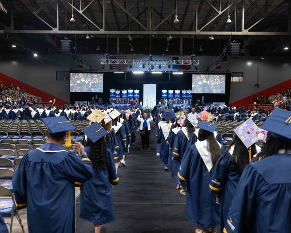 HCC students line up during a Commencement Ceremony at NRG Center in Houston.
