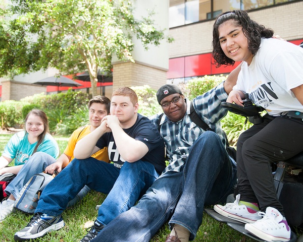 VAST Academy students socializing in the courtyard of a campus