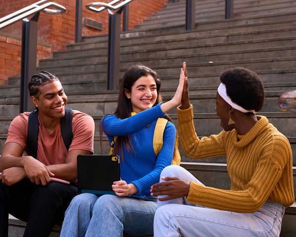 Student celebrating success on campus