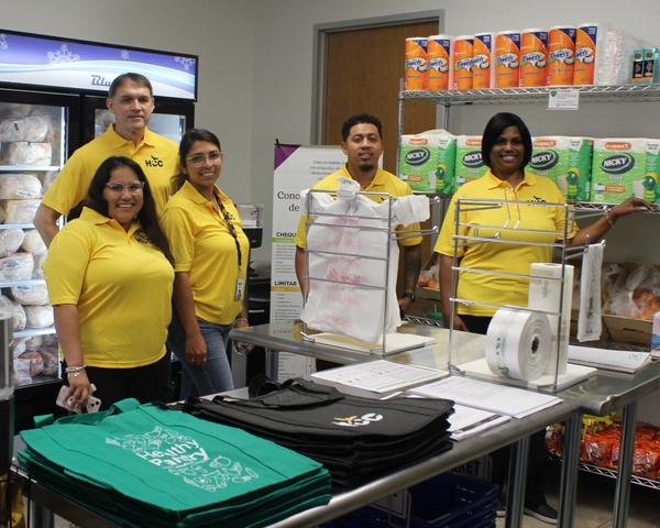 HCC staff members take part in the HCC West Loop Eagle Market Ribbon Cutting Ceremony.
