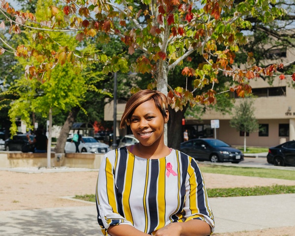 Female continuing education student sitting on a bench