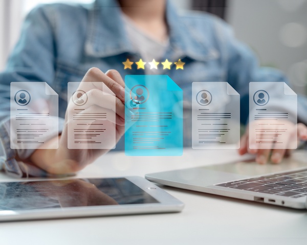 A student digitally reviewing her resume online.