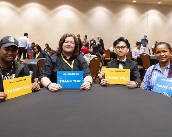 HCC scholarship recipients thanking the HCC Foundation with signs