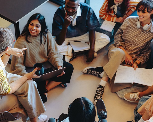 Students having a spirited discussion with their professor