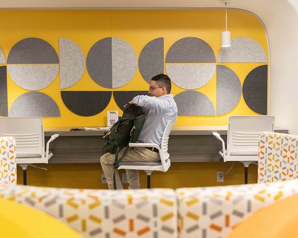 Student Sitting at Desk Digital Access Center