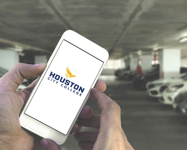 Student using their phone from a parking garage to access the HCC Wifi Network