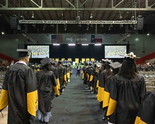HCC students line up during a Commencement Ceremony at NRG Center in Houston.
