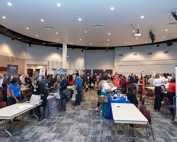 Alumni socializing at a career meet and greet event
