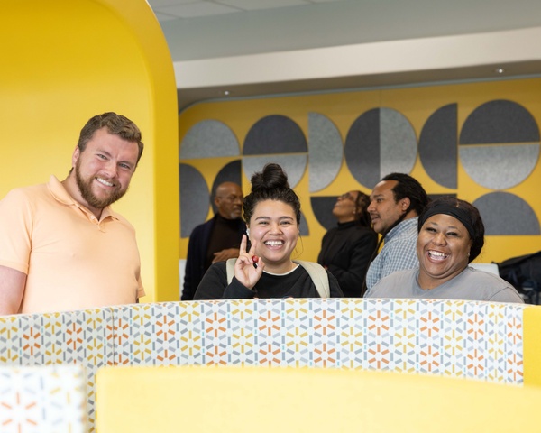Group photo of three smiling students