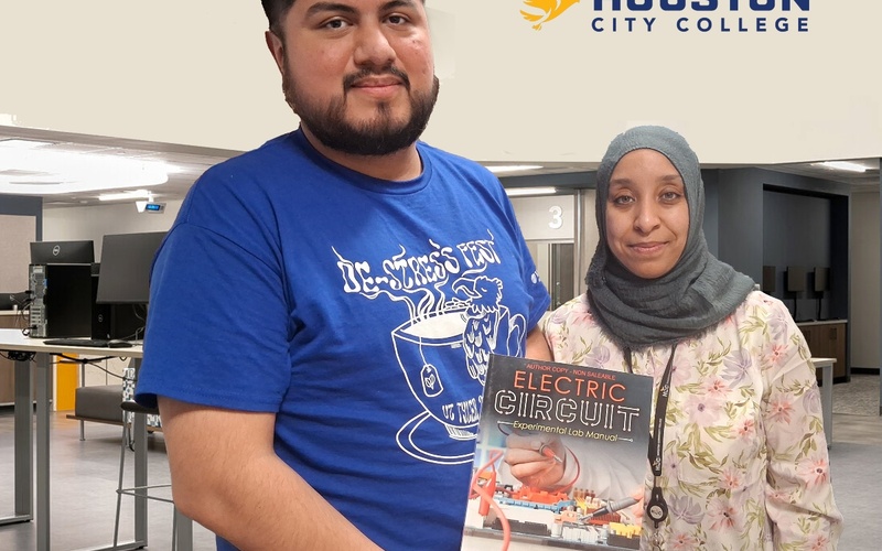 HCC student Hector Villasana and full-time faculty member Dr. Reem Salim display the experimental lab manual that they wrote.