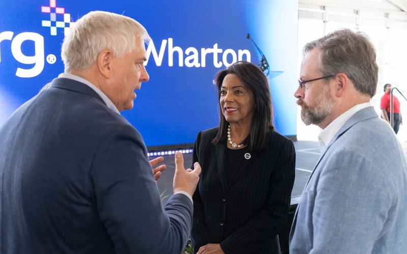 Matthew Pistner, president of NRG Wholesale, visits with Chancellor Margaret Ford Fisher, Ed.D., and HCC Trustee Sean Cheben following the partnership announcement