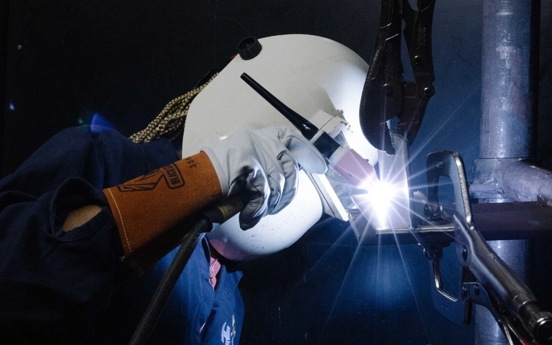 An HCC student wielder fuses some pieces of metal.