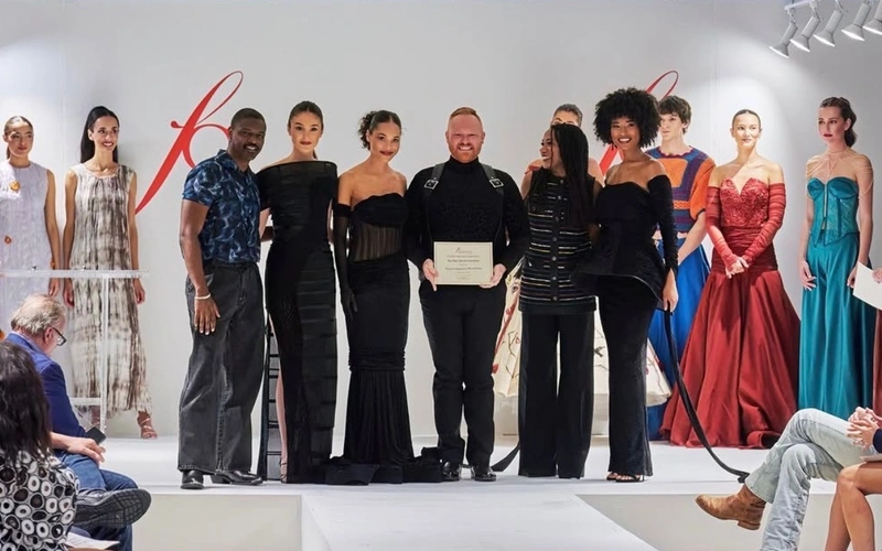 Eggleston Wooldridge (center) earned the Paris American Academy Couture Award during the FGI Dallas Scholarship Competition, which will afford him the opportunity to study abroad in Paris this summer.