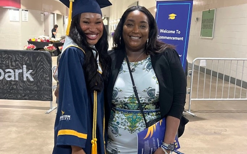 Isabelle Arusiuka and Iszella Flowers, supervisor, Student Accounts, pose for a photo at the HCC Spring 2026 Commencement Ceremony.