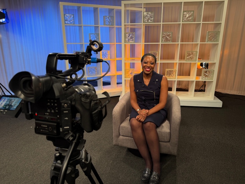 Brittaney Wilmore sits in a TV studio