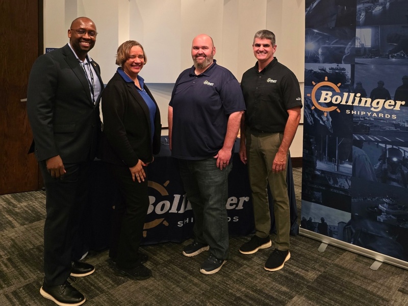 Representatives from HCC and Bollinger Shipyards pose for a photo.