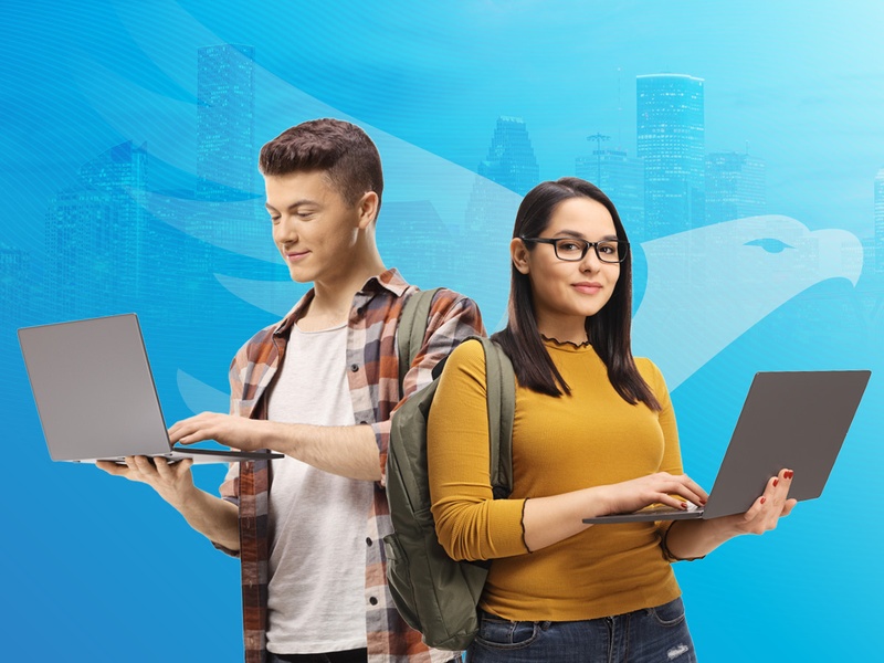HCC students holding laptops
