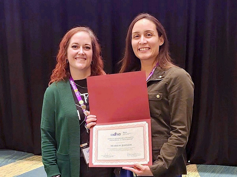 Dental Hygiene student Maren Jensen of Katy, Texas, accepts the Omega Seminars Jan Smith Memorial Scholarship at the Texas Dental Hygiene Association conference on March 1.