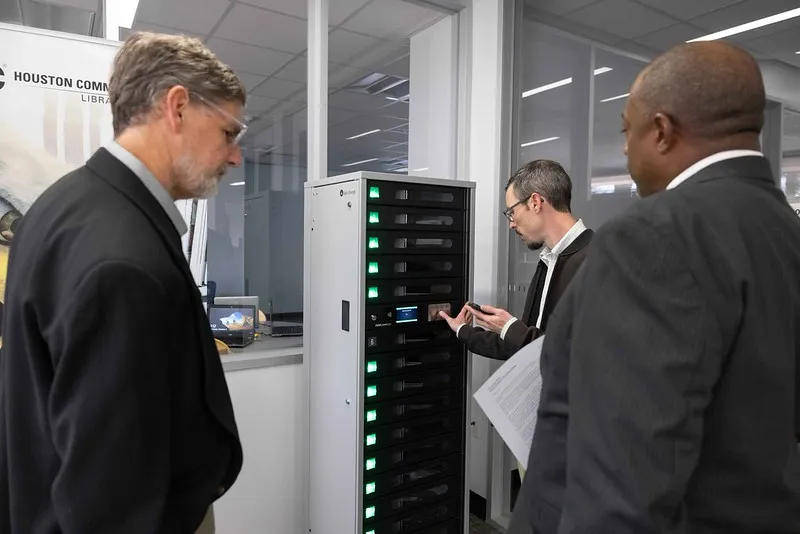 Vistors observing a server at the Digital Access Center