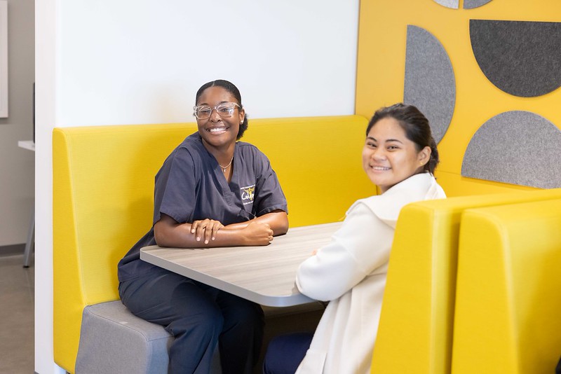 Students Sitting at the Digital Access Center Booth
