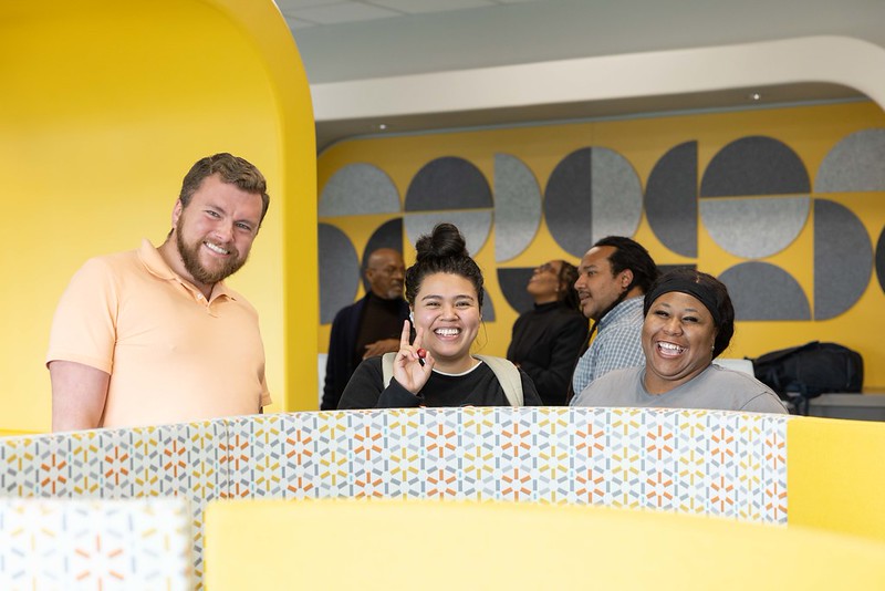 Students smile for the camera at the Digital Access Center.