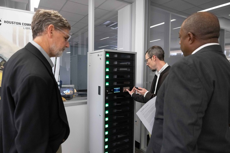 Vistors observing a server at the Digital Access Center